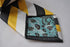 black, yellow and grey striped tie